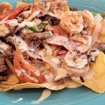 No Manches Wey - Steak, chicken and shrimp nachos with cheese, onions and peppers - Mexican Near Me - Orange Park, Florida No Manches Wey - Steak, chicken and shrimp nachos with cheese, onions and peppers - Mexican Near Me - Orange Park, Florida