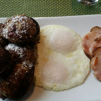 Urbana Craeft Kitchen - This was the ebelskivers and eggs with special bacon which I think is Canadian bacon. These are lingonberry and wild rice ones. - Breakfast & Brunch Near Me - Bloomington, Minnesota