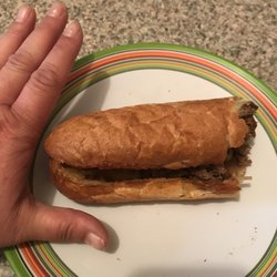 Athens Pizza & Family Restaurant Keene - My hands bigger than this roll...it doesn't seem to have any life left in it  it's given up because of its failure to be a great sub