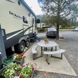 Clearwater Crossing Rv Park - Our site with table and fire pit