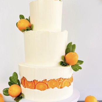 Sugar Chef - a three tiered cake with oranges on top - Custom Cakes Near Me Sugar Chef - a three tiered cake with oranges on top - Custom Cakes Near Me