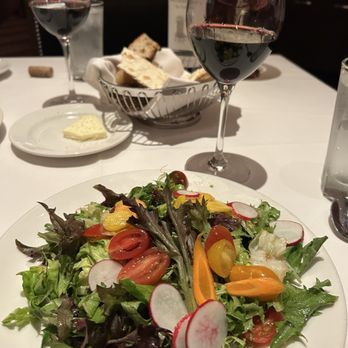 The Capital Grille - Salad with bread in the background. The bread serving here is outstanding! - Steakhouses Near Me - Parsippany, New Jersey The Capital Grille - Salad with bread in the background. The bread serving here is outstanding! - Steakhouses Near Me - Parsippany, New Jersey