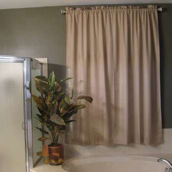 Hanging Around Town - Drapes keeping the street lights glow out in the main bathroom! - Art Installation Near Me