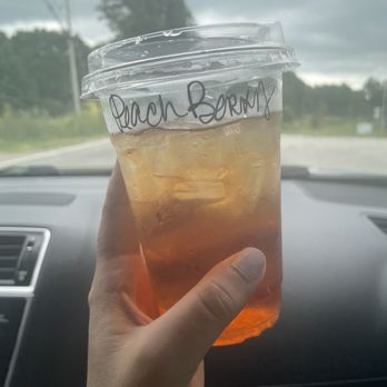 Gather Coffee Lounge - a hand holding a cup of iced tea - Coffee Roasteries Near Me - Oneida, Tennessee Gather Coffee Lounge - a hand holding a cup of iced tea - Coffee Roasteries Near Me - Oneida, Tennessee