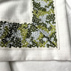It is all in the details. This lovely embroidered ribbon adds the finishing detail to a pair of drapery.