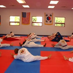 New Hampshire Martial Arts Academy - One of our classes doing a group stretch