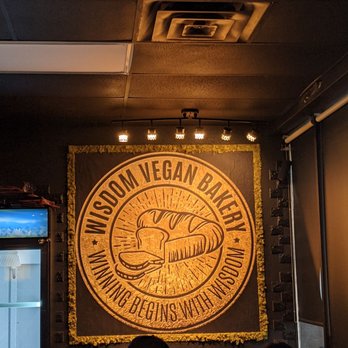 Wisdom Bakery & Cafe - a man and a woman sitting on a couch - Vegan Near Me - Spring, Texas Wisdom Bakery & Cafe - a man and a woman sitting on a couch - Vegan Near Me - Spring, Texas