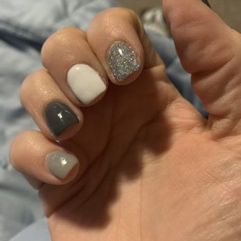 Gloss & Feathers - Hard to see but the light gray nails finish is all messed up and the dark gray has a bump in it - Nail Salons Near Me - Phoenix, Arizona