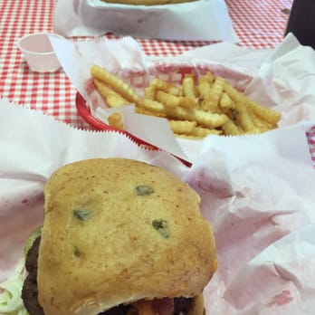 Whistle Stop Cafe - Jalapeño burger with side of fries and PO-boy sandwich. - Cafes Near Me - Wiggins, Mississippi