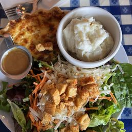 3 cheese quiche with a side House Salad and mashed potatoes