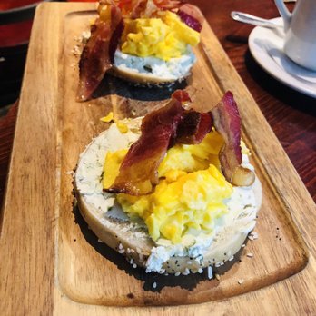 Half Sour - Everything bagel with jalepeno cream cheese topped with scrambled eggs and bacon. - New American Near Me - Chicago, Illinois Half Sour - Everything bagel with jalepeno cream cheese topped with scrambled eggs and bacon. - New American Near Me - Chicago, Illinois