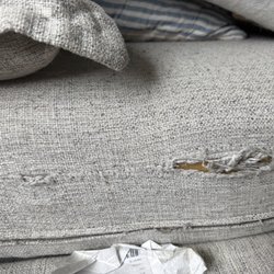 Bernie & Phyl's Furniture - One of the three cushions coming apart at the seams.