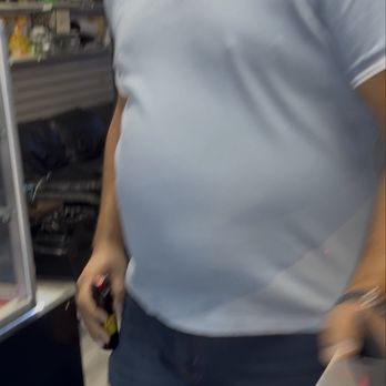 Beverly Smokeshop - Joseph (Owner) placing back bear spray after he sees me recording. - Tobacco Shops Near Me - Los Angeles, California