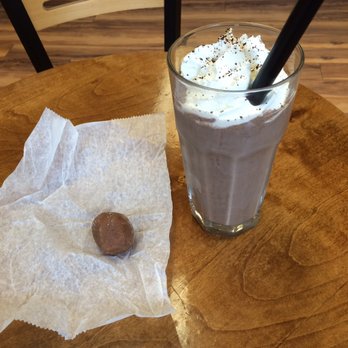 Muggswigz Coffee & Tea Co. - a cup of coffee and a chocolate covered donut - Coffee & Tea Near Me - Canton, Ohio Muggswigz Coffee & Tea Co. - a cup of coffee and a chocolate covered donut - Coffee & Tea Near Me - Canton, Ohio