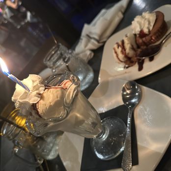 The Grill on Main - This was my birthday dessert with the molten lava cake. It was amazing. - American Near Me - La Quinta, California