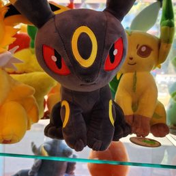 a display of pokemon plush toys