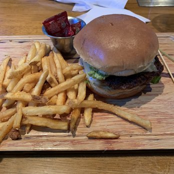 Twin Peaks - Avocado Smash Burger with fries - Sports Bars Near Me - Orlando, Florida
