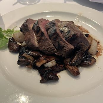 The Capital Grille - Sliced Filet Mignon with Cipollini Onions, Wild Mushrooms and Fig Essence - Steakhouses Near Me - Houston, Texas The Capital Grille - Sliced Filet Mignon with Cipollini Onions, Wild Mushrooms and Fig Essence - Steakhouses Near Me - Houston, Texas