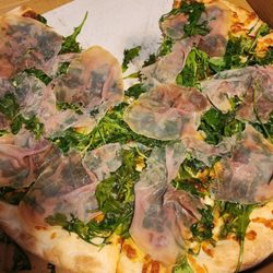 Carmine's Pizza - Prosciutto arugula pizza