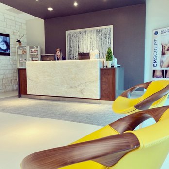 Dz Design Interiors - Frankie's touch - Italian leather/wood chairs, lighting, artwork, custom-designed reception counter. - Interior Design Near Me