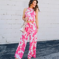 MOD ON TREND - Model is wearing a pink abstract printed matching set with wedges.