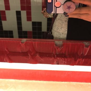 AMC Raceway 10 - Mirror being held down by a border of red duct tape! - Cinema Near Me - Westbury, New York