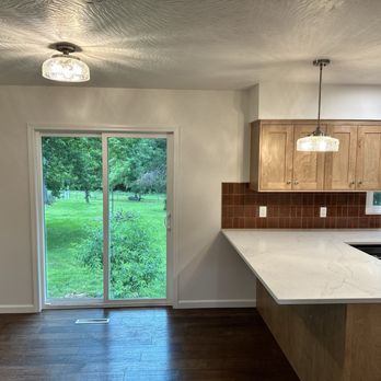 Nova Interiors - Newly installed sliding door and part of new cabinets and countertops. - General Contractors Near Me - Springfield, Missouri