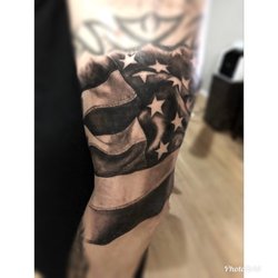 Royal Sword Tattoo & Piercing