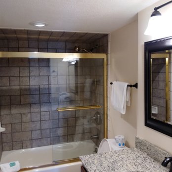 Blue Water Construction & Landscaping - Remodeled bath with pocket door wall removed.  New vanity, countertop, recessed lights. - Landscaping Near Me