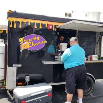 Trucky Cheese - a man ordering food from a food truck - Food Trucks Near Me Trucky Cheese - a man ordering food from a food truck - Food Trucks Near Me