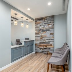 Pure Dental - Reception area at Pure Dental featuring a welcoming front desk, contemporary décor, and patient check-in space.