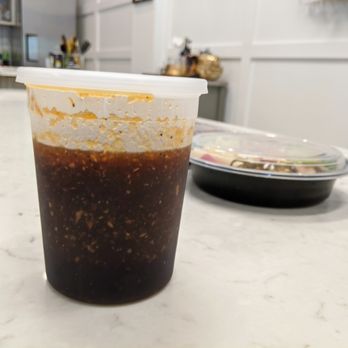 JS KITCHEN by Jang Su Jang - Container of Jang Su Jang's "Yum Yum Sauce" (or was it "Yummy Sauce?"). Sugar, soy sauce, sesame oil, and more. One of JSJ's meat marinades. - Korean Near Me - Duluth, Georgia JS KITCHEN by Jang Su Jang - Container of Jang Su Jang's "Yum Yum Sauce" (or was it "Yummy Sauce?"). Sugar, soy sauce, sesame oil, and more. One of JSJ's meat marinades. - Korean Near Me - Duluth, Georgia