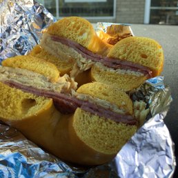 Pork roll and egg on an egg bagel with salt and pepper.