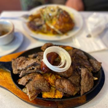 Havanazucar Cuban Restaurant - a plate of meat with onions - Cuban Near Me - Hesperia, California Havanazucar Cuban Restaurant - a plate of meat with onions - Cuban Near Me - Hesperia, California