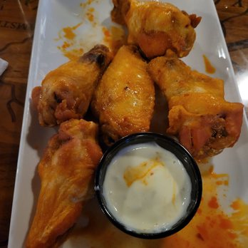 Big Ditch Brewing - 5 of 10 the wings we ordered. Too big too eat all 10. Hahaha. Mild is delish but spicy. - New American Near Me - Buffalo, New York