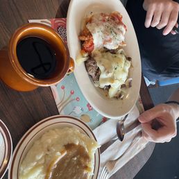 a plate of mashed potatoes and gravy