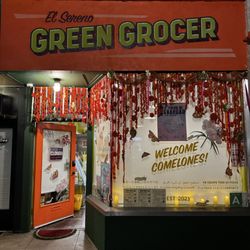 El Sereno Greengrocer - Autumn window evening display for day of the dead celebrations. Halloween night decorations.