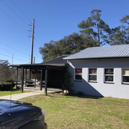 Exterior outside entrance of Summers Smokehouse - The restaurant entrance. That's the left hand side of the building from the parking lot. - Tallahassee, Florida Exterior outside entrance of Summers Smokehouse - The restaurant entrance. That's the left hand side of the building from the parking lot. - Tallahassee, Florida