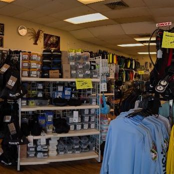 Force E Scuba Centers - Pano - A panoramic interior of a retail store displaying hats, clothing, and accessories with shelves, racks, and a checkout counter. - Scuba Diving Near Me - Riviera Beach, Florida
