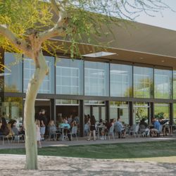 Commons Coffeehouse - Open garage doors, fresh air, and a big green lawn--an easy spot for parents to enjoy coffee while kids play.