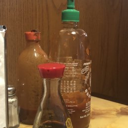 Look at the top of the bottles on the table