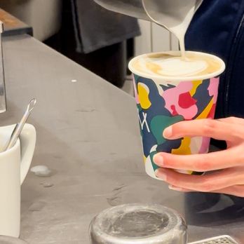 Matchstick Café - a person pouring coffee into a cup - Coffee & Tea Near Me - Vancouver, British Columbia Matchstick Café - a person pouring coffee into a cup - Coffee & Tea Near Me - Vancouver, British Columbia