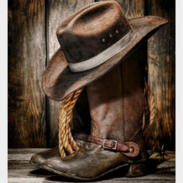 a cowboy hat and boots a cowboy hat and boots