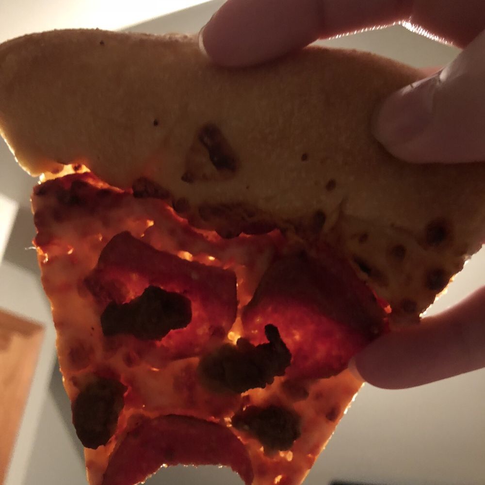 Pizza Hut - a hand holding a slice of pizza - Pizza Near Me - Cambridge, Minnesota Pizza Hut - a hand holding a slice of pizza - Pizza Near Me - Cambridge, Minnesota