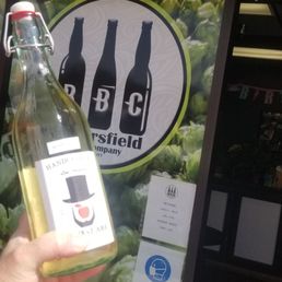 a hand holding a bottle of beer a hand holding a bottle of beer