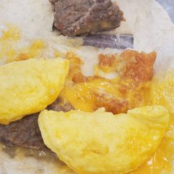 Arby's - This is a wrap that has no hash brown but a little piece and the wrap got stuck to the paper rip everything apart