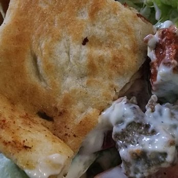 Halal Stop - a salad and pita chips on a plate - Halal Near Me - Brooklyn, New York
