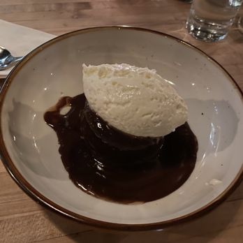 Otis - Sticky toffee pudding - Date Cake, Toffee Sauce, Ricotta Whipped Cream  Note: kitchen swapped toffee sauce for chocolate ganache. - New American Near Me - Brooklyn, New York