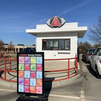 Atomic Coffee Bar - The atomic menu sign from the view of my car waiting in line. - Coffee & Tea Near Me - Bettendorf, Iowa