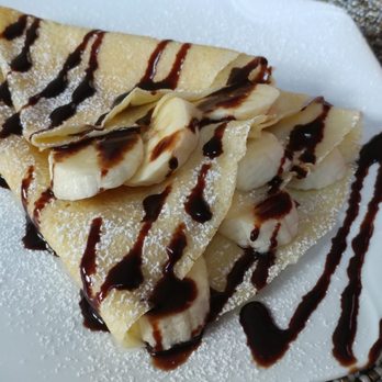 Totally Edible - a plate of food with bananas and chocolate sauce - Food Trucks Near Me Totally Edible - a plate of food with bananas and chocolate sauce - Food Trucks Near Me